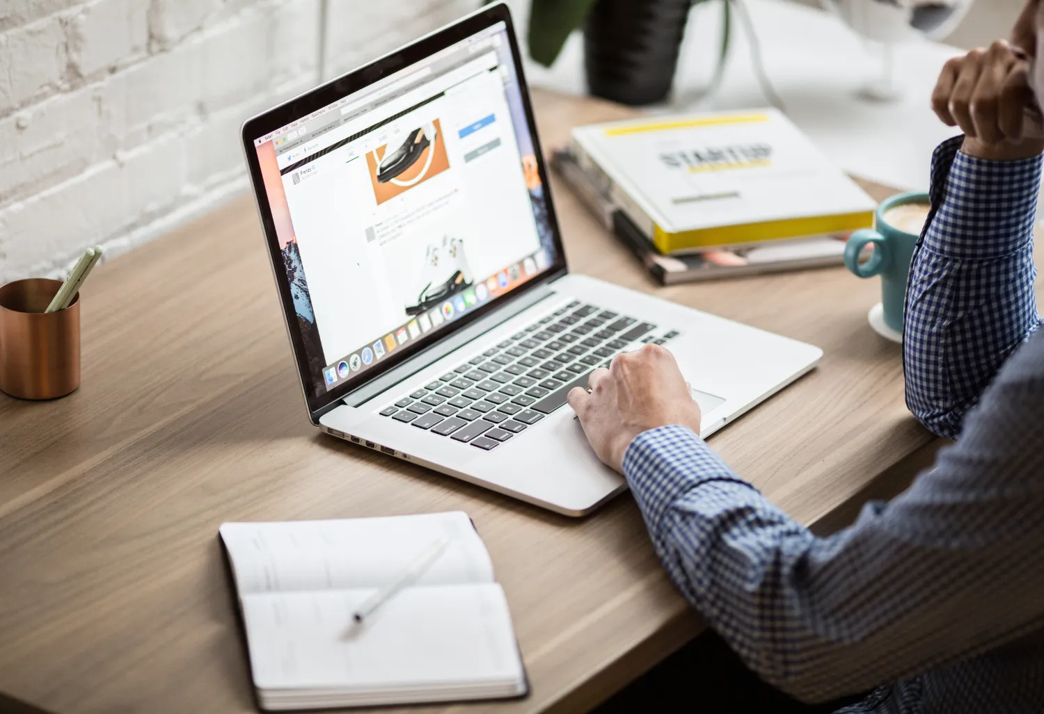 Person reviewing AI Listings Marketing office